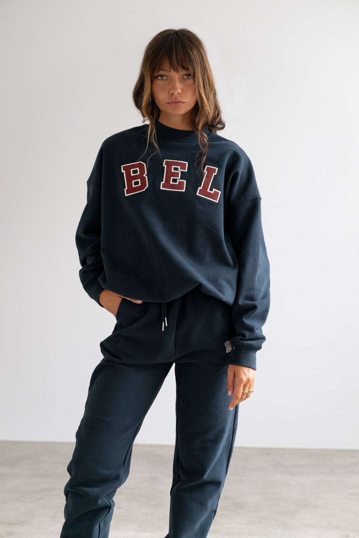 COMING SOON Varsity Hoodie Navy-Sweatshirts-Tienda Ropa Leggings Yoga Sostenibles Reciclados Mujer On-line Barcelona Believe Athletics Sustainable Recycled Yoga Clothes